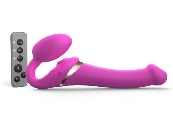 Ярко-розовый безремневой страпон Multi Orgasm Size M с клиторальной стимуляцией от Strap-on-me