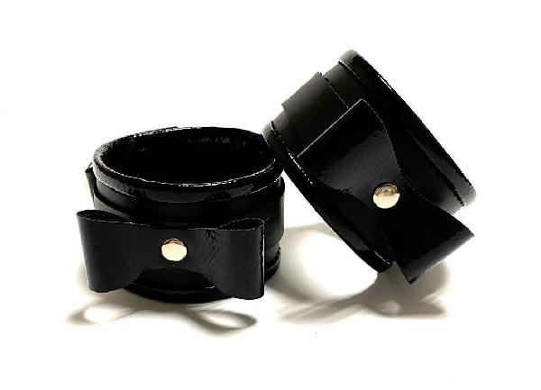 Черные наручники с бантиками из эко-кожи от БДСМ Арсенал